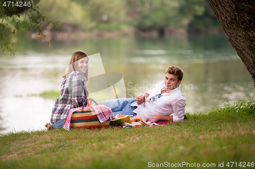 Image of Couple in love enjoying picnic time