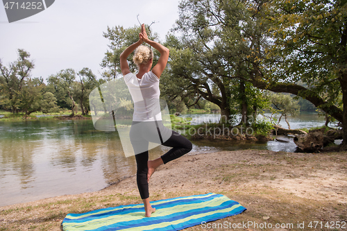 Image of woman meditating and doing yoga exercise