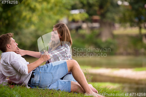 Image of Couple in love enjoying picnic time