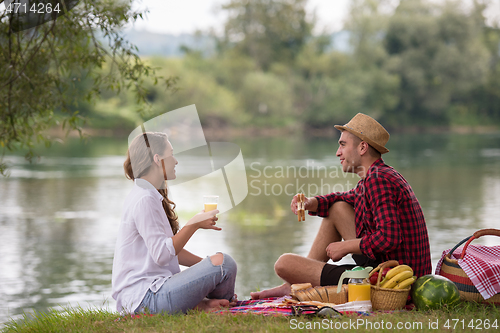 Image of Couple in love enjoying picnic time