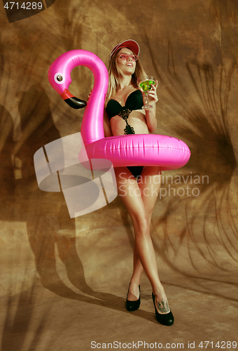 Image of Beautiful girl isolated on braun studio background