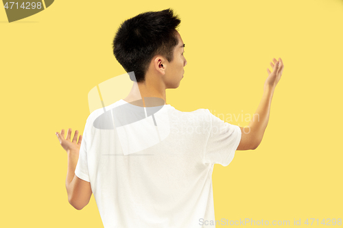 Image of Korean young man\'s half-length portrait on yellow background