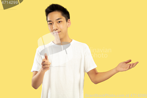 Image of Korean young man\'s half-length portrait on yellow background