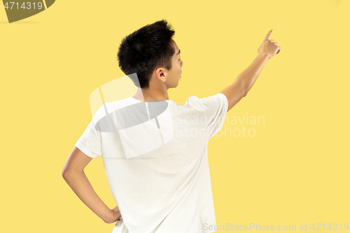 Image of Korean young man\'s half-length portrait on yellow background