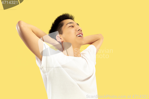 Image of Korean young man\'s half-length portrait on yellow background
