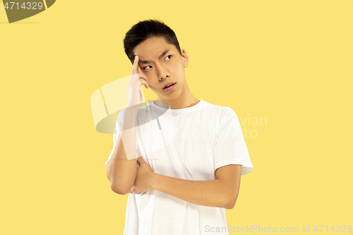 Image of Korean young man\'s half-length portrait on yellow background