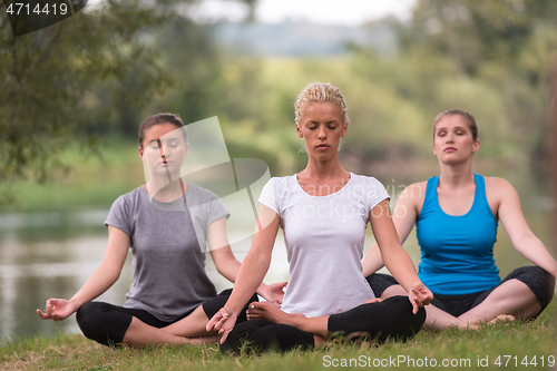 Image of women meditating and doing yoga exercise