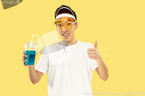 Image of Korean young man\'s half-length portrait on yellow background