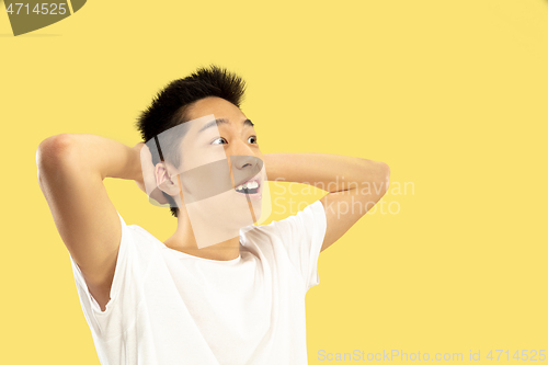 Image of Korean young man\'s half-length portrait on yellow background