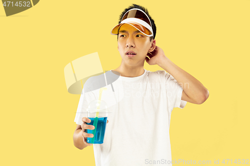 Image of Korean young man\'s half-length portrait on yellow background