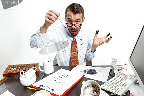 Image of The young man with the broke pen and leaking ink