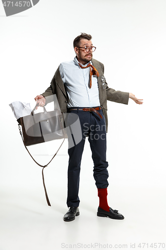 Image of Young man comes to work rumpled and untidy