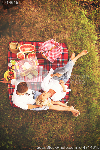 Image of top view of couple enjoying picnic time