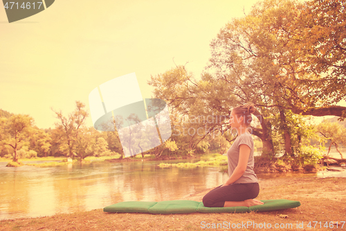 Image of woman meditating and doing yoga exercise