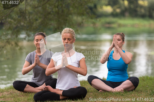 Image of women meditating and doing yoga exercise