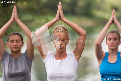 Image of women meditating and doing yoga exercise