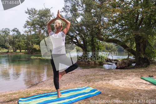 Image of woman meditating and doing yoga exercise