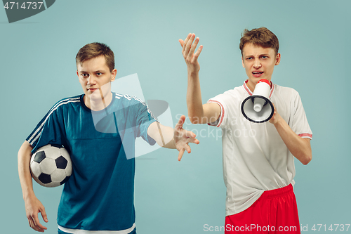 Image of Two young men isolated on blue background