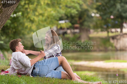 Image of Couple in love enjoying picnic time