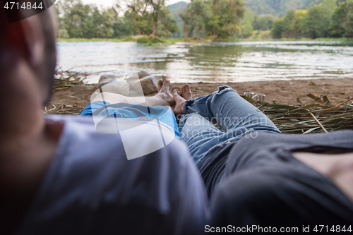 Image of couple spending time together in straw tent