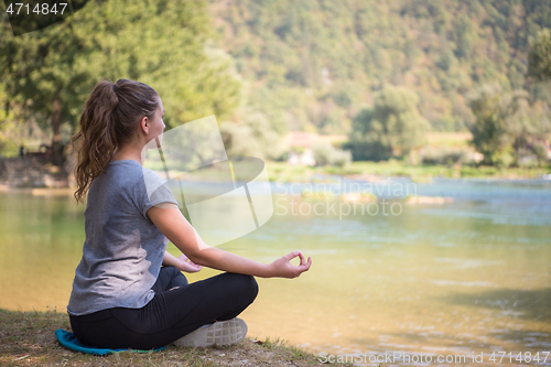 Image of woman meditating and doing yoga exercise