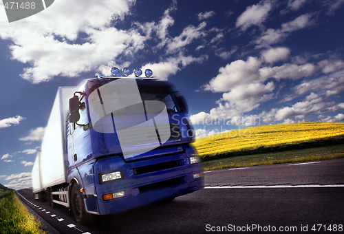 Image of truck driving at dusk/motion blur