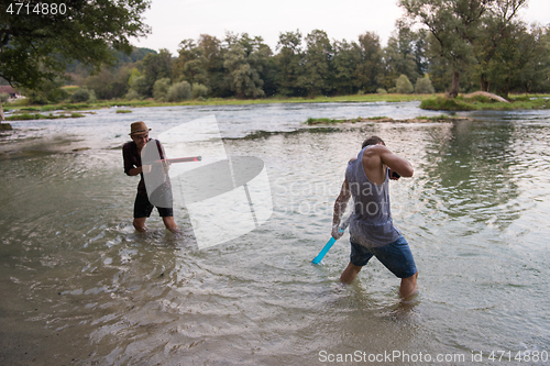 Image of young men having fun with water guns