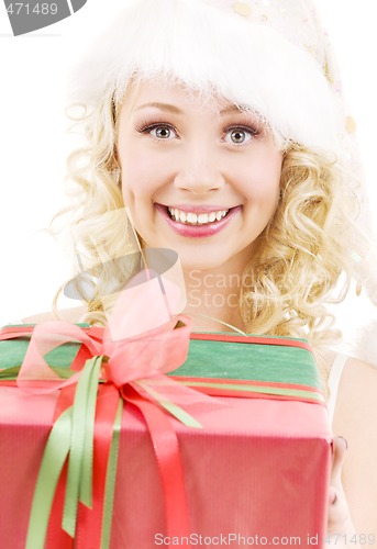 Image of cheerful santa helper girl with gift box