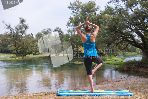 Image of woman meditating and doing yoga exercise