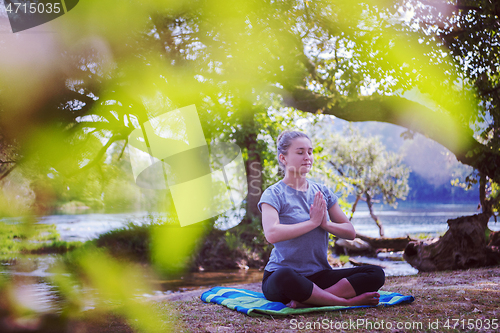 Image of woman meditating and doing yoga exercise