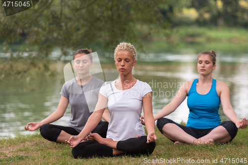 Image of women meditating and doing yoga exercise