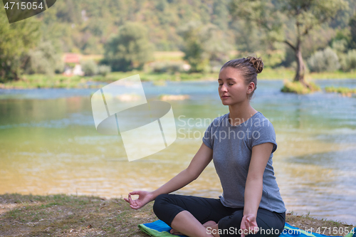 Image of woman meditating and doing yoga exercise