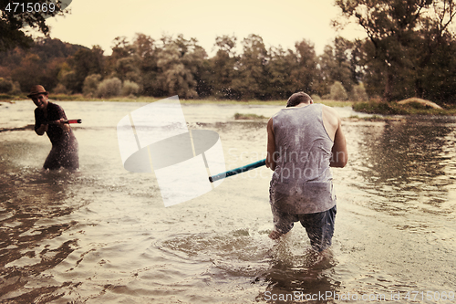 Image of young men having fun with water guns