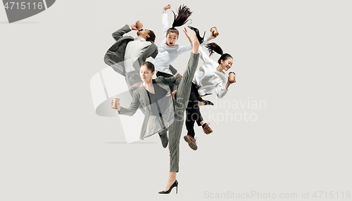 Image of Office workers jumping isolated on studio background