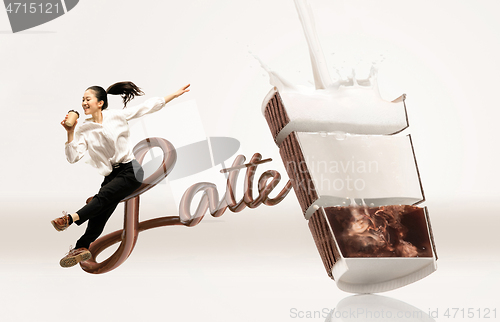 Image of Office worker jumping isolated on studio background