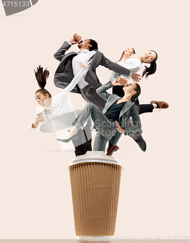 Image of Office workers jumping isolated on studio background