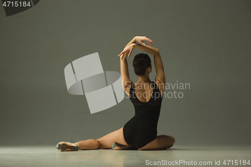 Image of Young graceful female ballet dancer dancing in mixed light