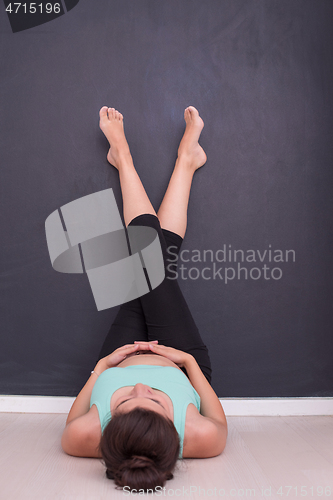 Image of pregnant women laying on the floor