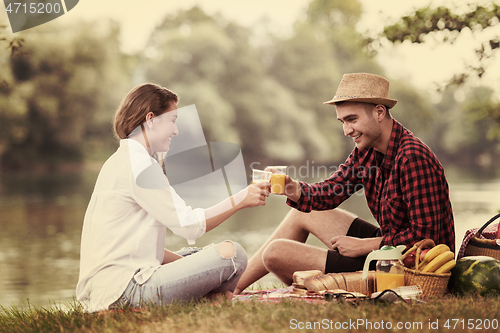 Image of Couple in love enjoying picnic time