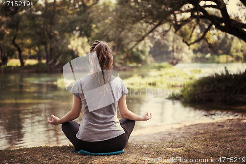 Image of woman meditating and doing yoga exercise