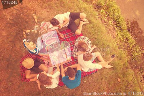 Image of top view of group friends enjoying picnic time