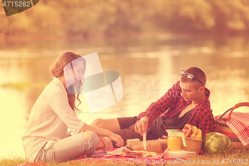 Image of Couple in love enjoying picnic time