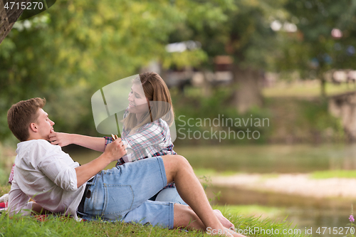 Image of Couple in love enjoying picnic time