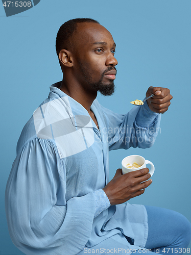 Image of Young man as a medieval grandee on blue background