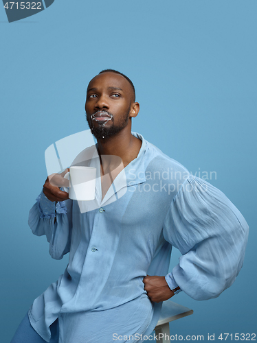 Image of Young man as a medieval grandee on blue background