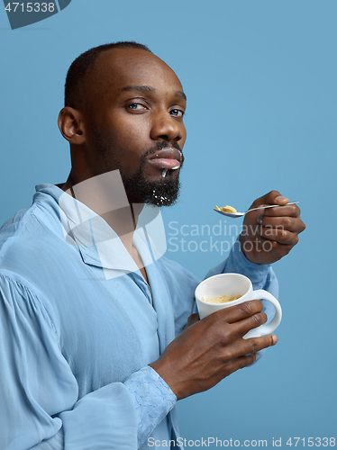 Image of Young man as a medieval grandee on blue background