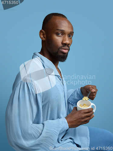 Image of Young man as a medieval grandee on blue background