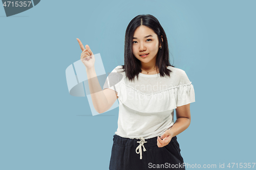 Image of Korean young woman\'s half-length portrait on blue background