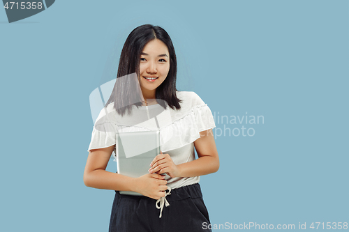 Image of Korean young woman\'s half-length portrait on blue background