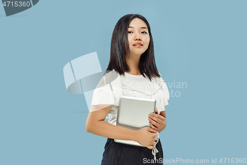 Image of Korean young woman\'s half-length portrait on blue background